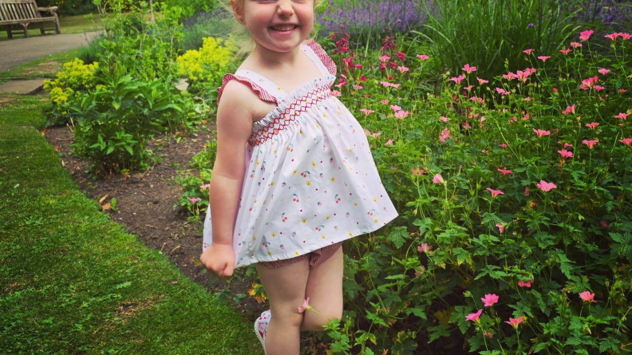 beautiful blonde hair girl modelling quality designer childrens clothes