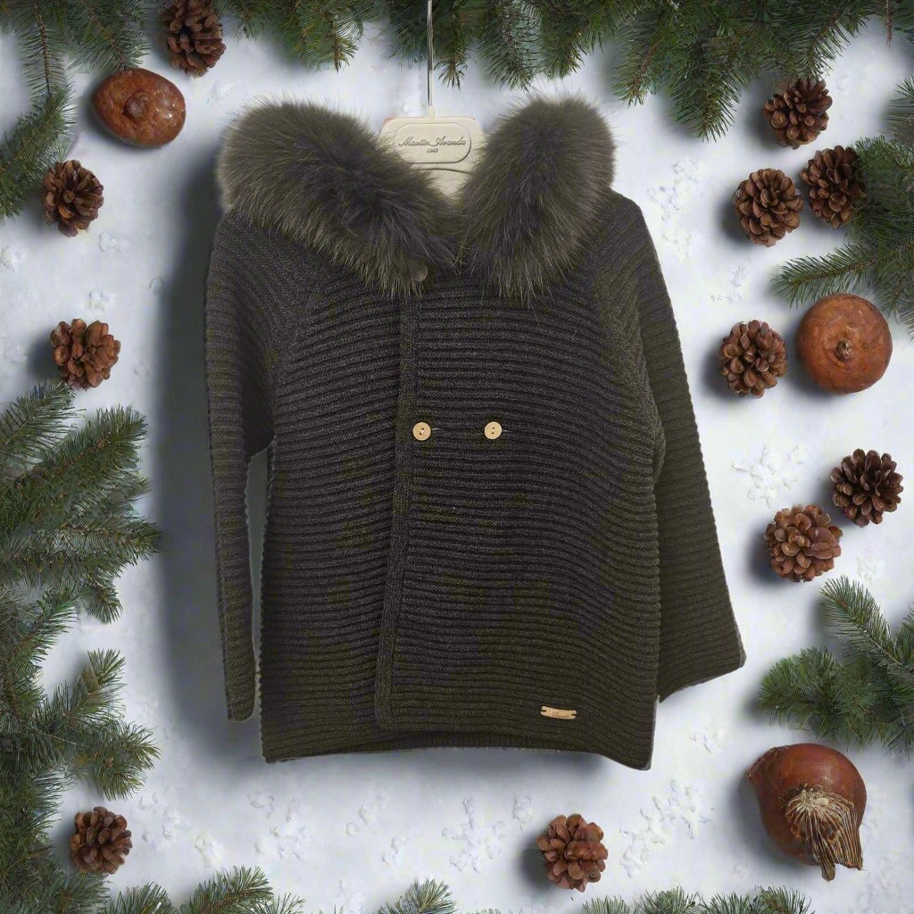 Dark green knitted jacket with fur hood on a white background