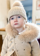 beige single pom hat from martin aranda