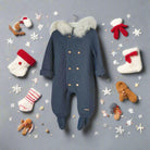 Blue baby snowsuit with fur hood on a white background