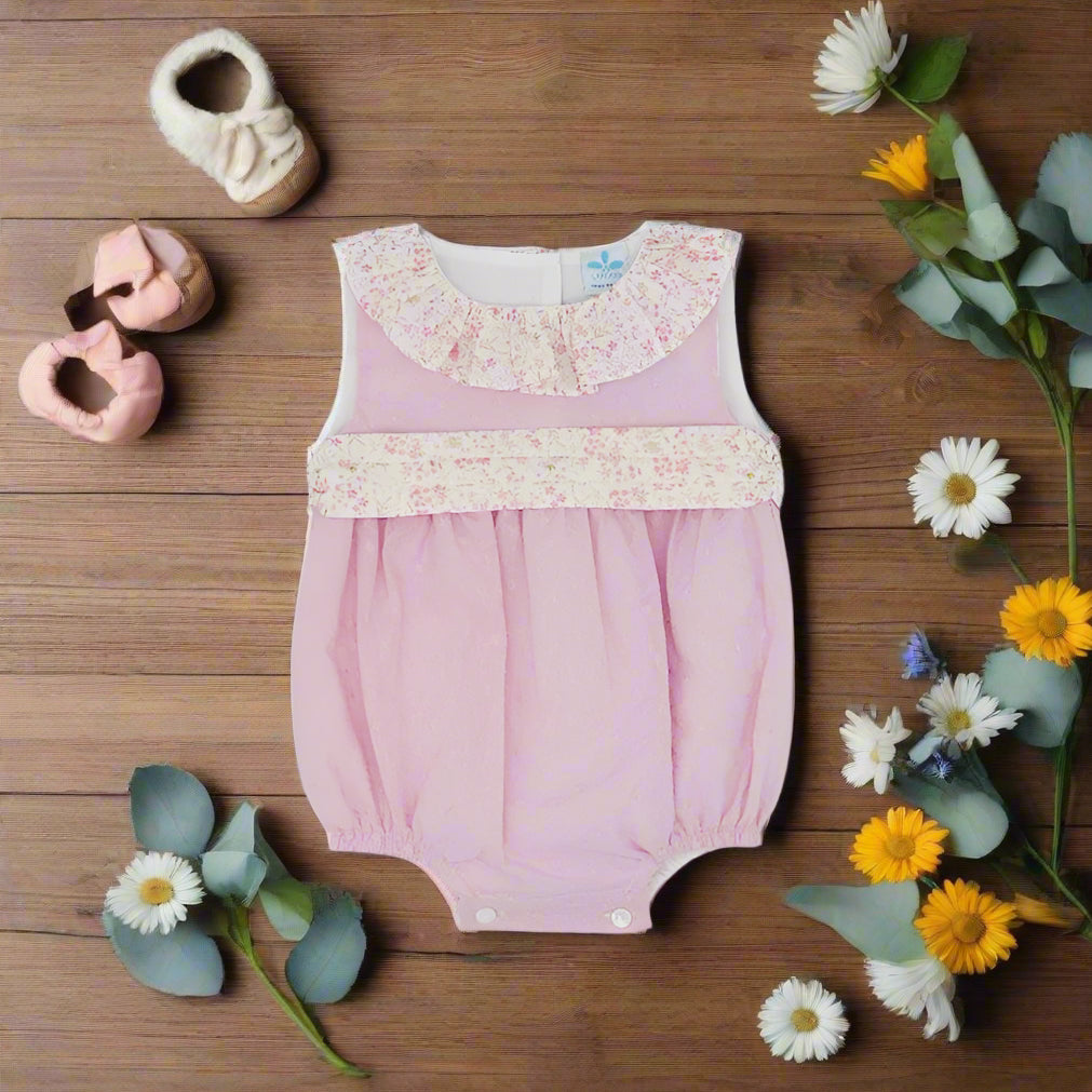 pink baby romper with floral print waistband and collar