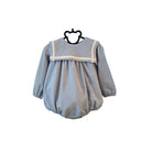 Light blue baby romper with white trim on a hanger against a white background