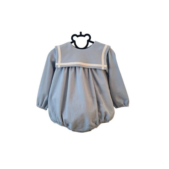 Light blue baby romper with white trim on a hanger against a white background