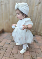 caramelo kids tulle dress and turban set available from tors childrens wear modelled by darla