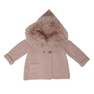 Pink coat with fur hood on a white background