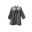 Black and white checkered dress with a sailor collar on a white background