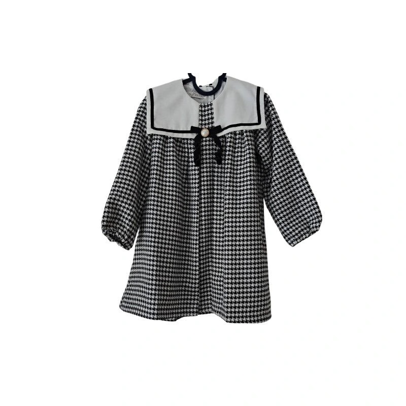 Black and white checkered dress with a sailor collar on a white background