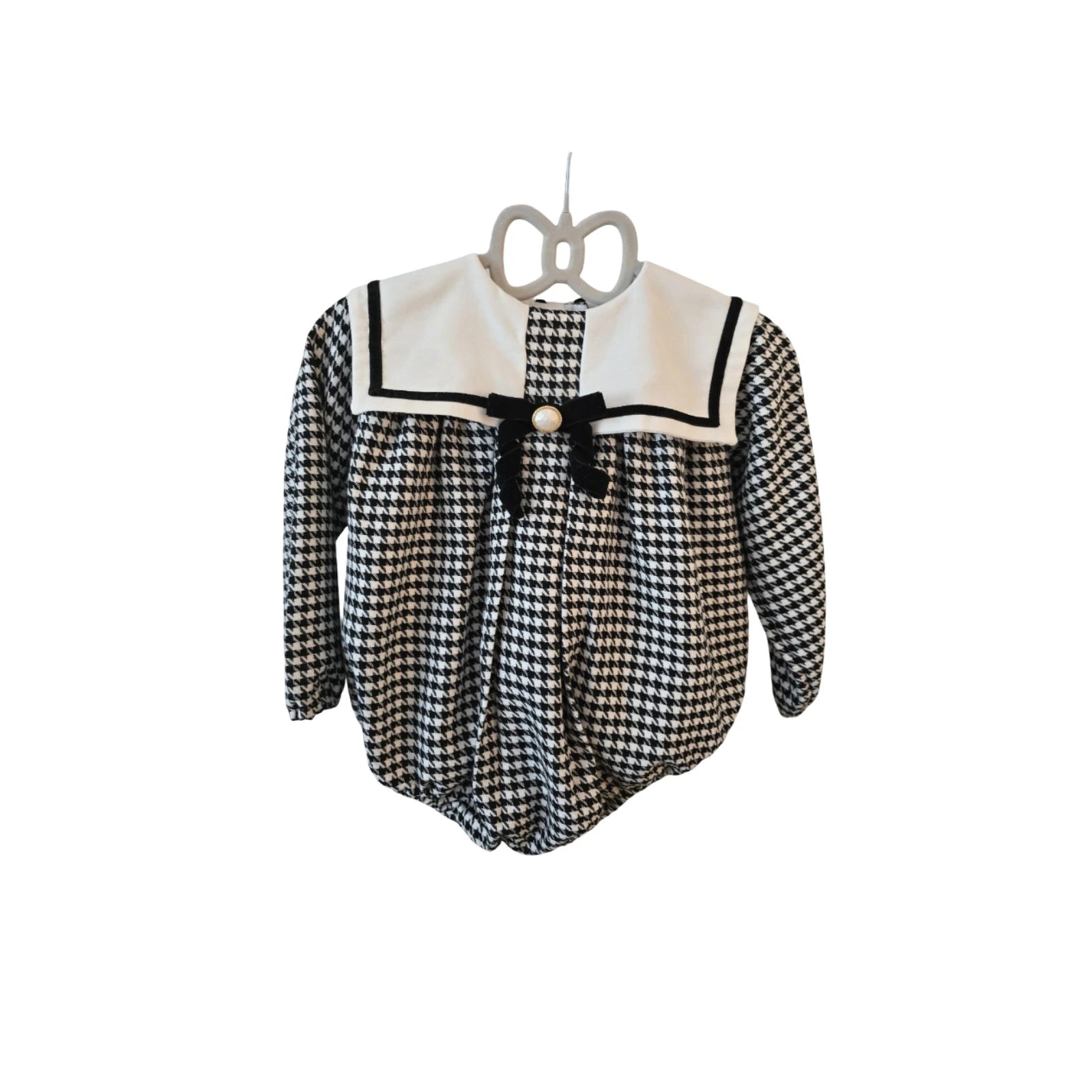 black houndstooth romper with white bib