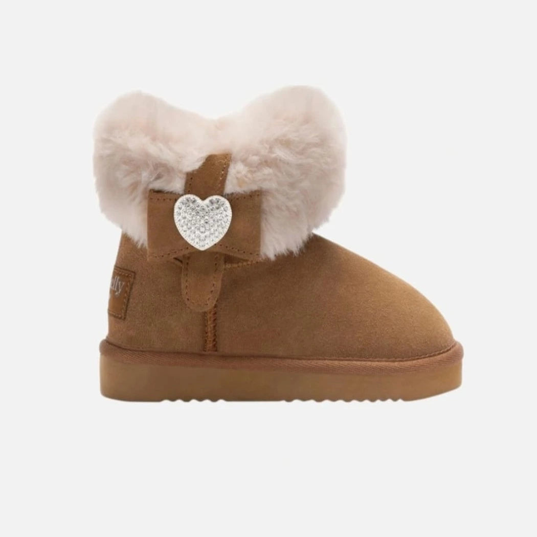 Brown boot with white fur and a heart-shaped embellishment on a light gray background