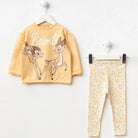 Children's outfit with yellow shirt and patterned pants featuring a deer design on a white background.