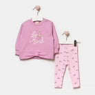 Pink children's outfit with a hoodie and pants on hangers against a white background