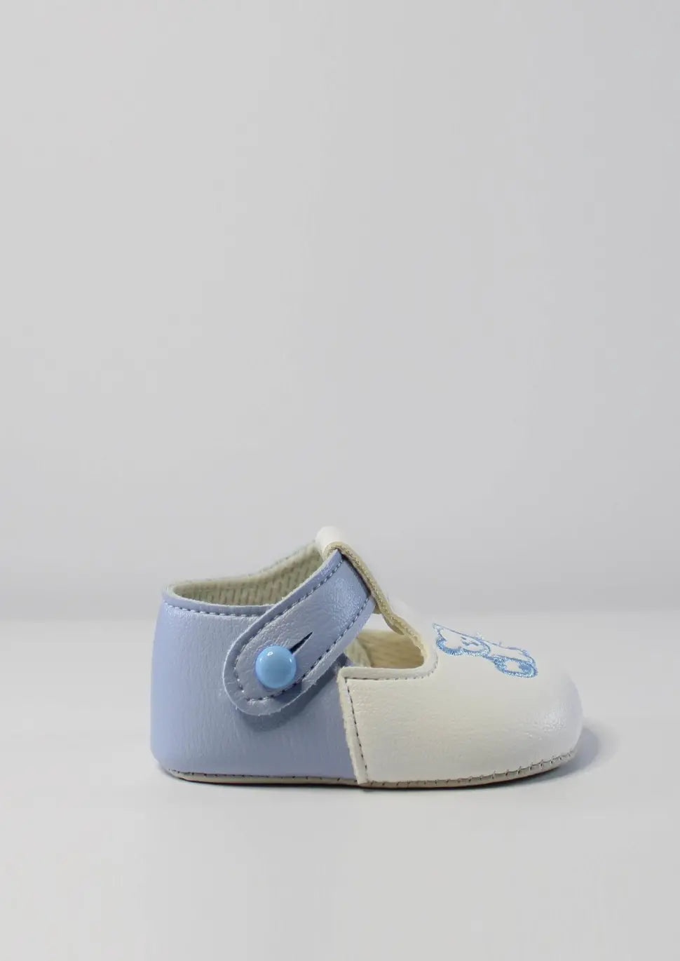 sky and white baypod shoes with teddy motif from tors childrens wear
